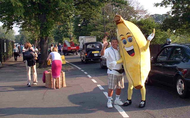 Sam with banana outside Wimbledon