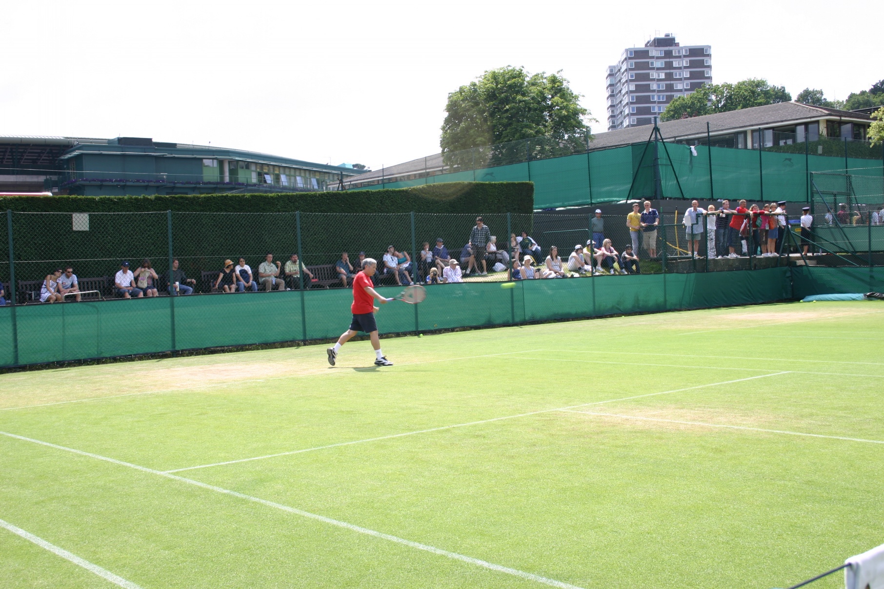 Sam hitting with coach in Wimbledon practice court